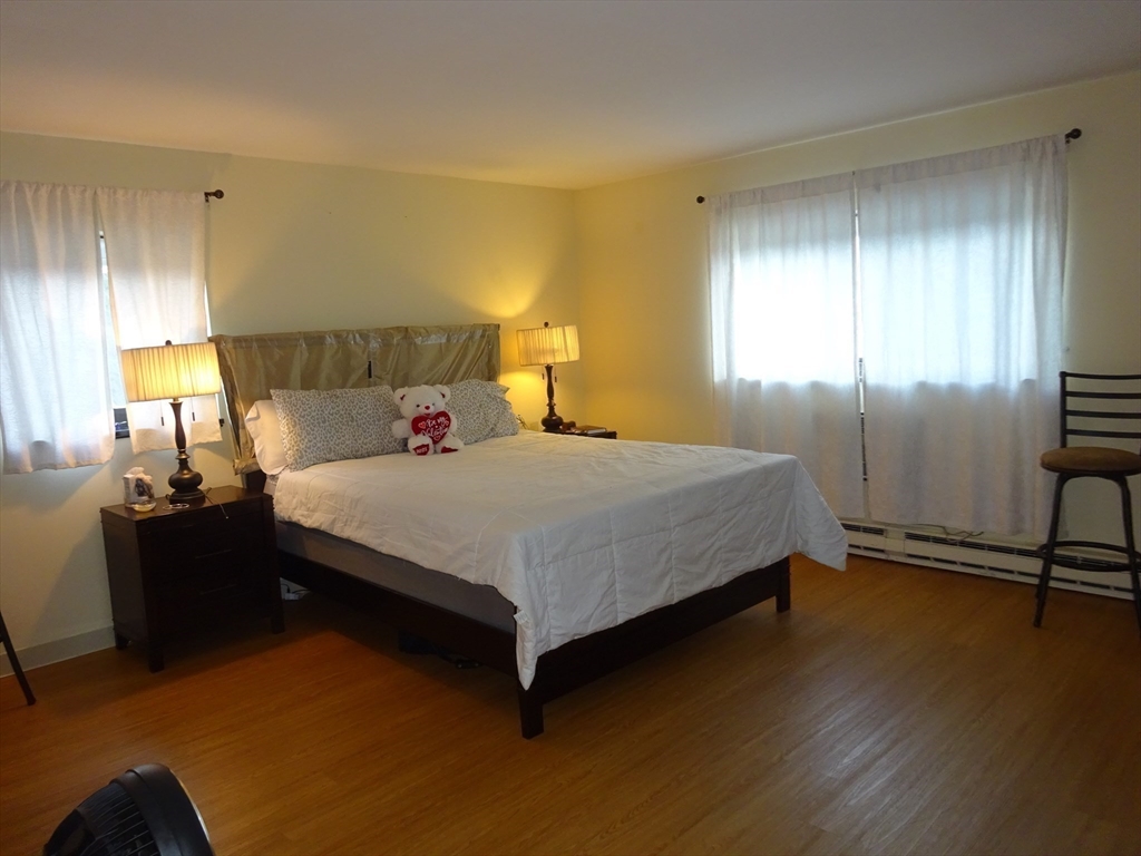 1321 Worcester Road, Unit 610 Framingham, MA 01701 - Photo 14 of 30 a bedroom with a bed and window