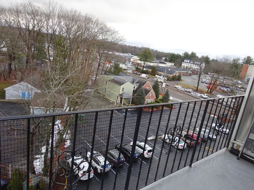 1321 Worcester Road, Unit 610 Framingham, MA 01701 - Photo 22 of 30 a view of a balcony with an outdoor seating