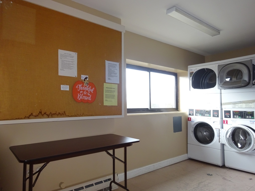 1321 Worcester Road, Unit 610 Framingham, MA 01701 - Photo 26 of 30 a utility room with dryer and washer