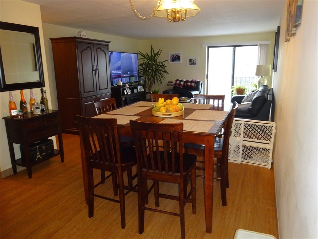 1321 Worcester Road, Unit 610 Framingham, MA 01701 - Photo 6 of 30 a view of a dining room with furniture