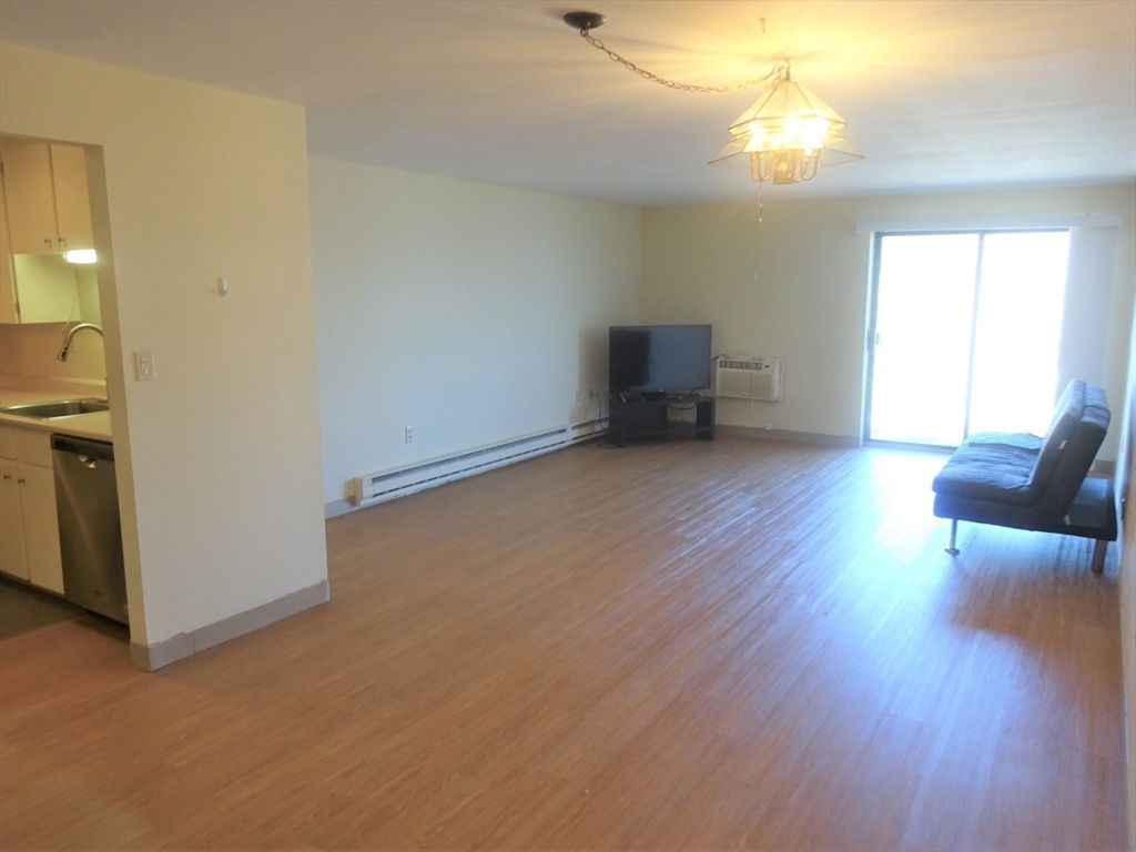 1321 Worcester Road, Unit 610 Framingham, MA 01701 - Photo 7 of 30 a view of livingroom with furniture and wooden floor
