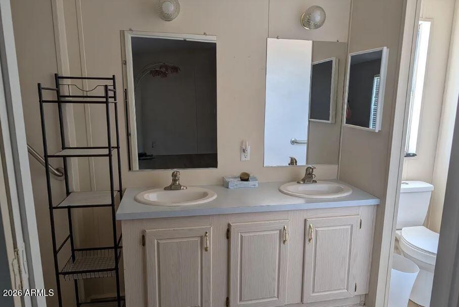 2000 South Apache Road, Unit 223 Buckeye, AZ 85326 - Photo 8 of 19 a bathroom with a sink and a mirror