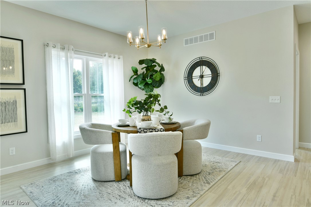 4780 State Rte 5 Cortland, OH 44410 - Photo 11 of 50 Recessed lighting, wood-finish flooring, and a contemporary chandelier