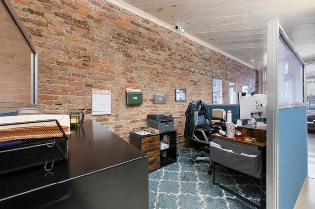 a view of a chairs and table in the balcony