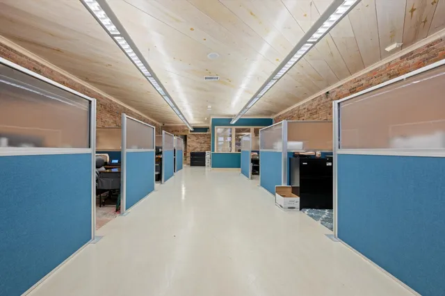 a big room with closet and windows