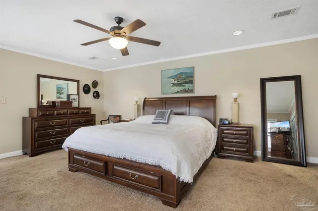 a bedroom with a bed and dresser