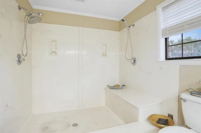a bathroom with a shower and a toilet