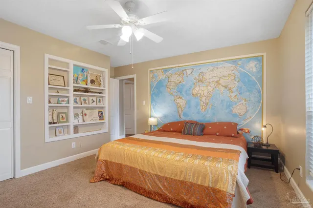 a bedroom with a large bed and a window