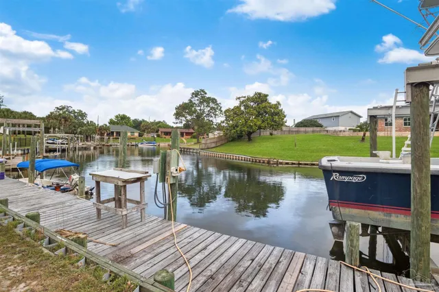 a view of a lake with a deck having patio