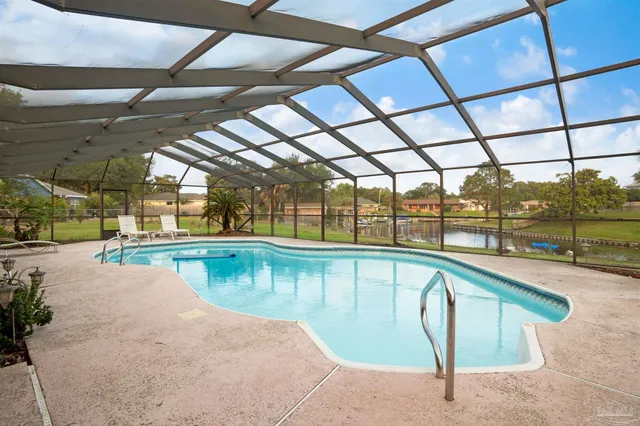 a view of a swimming pool with a porch