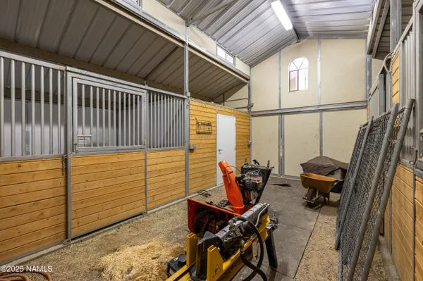 a view of a chairs and table in the patio