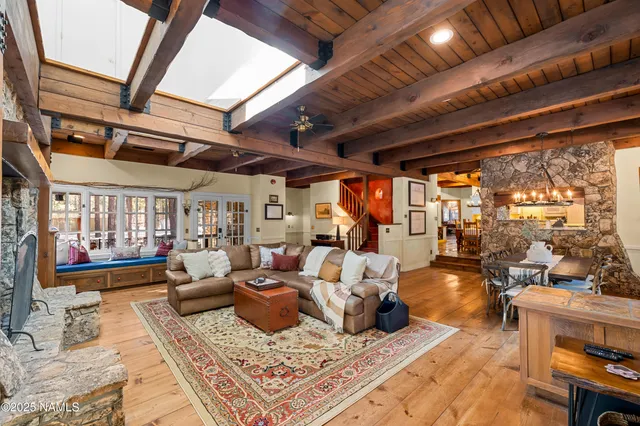 a view of a kitchen with furniture and wooden floor
