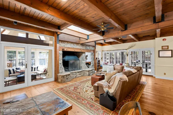 a dining hall with stainless steel appliances granite countertop a stove and cabinets