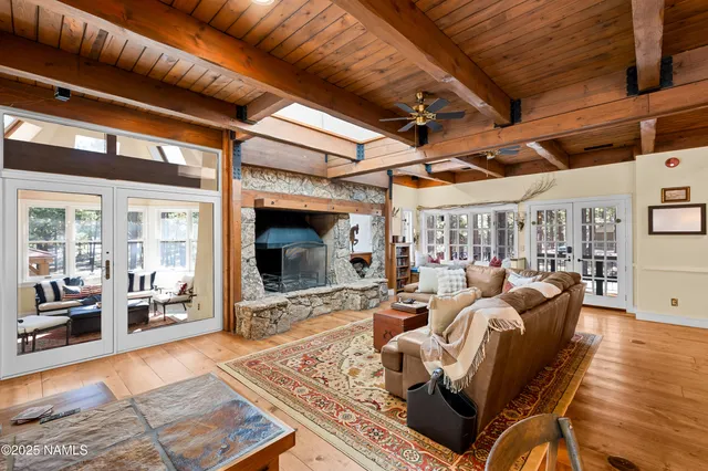 a dining hall with stainless steel appliances granite countertop a stove and cabinets