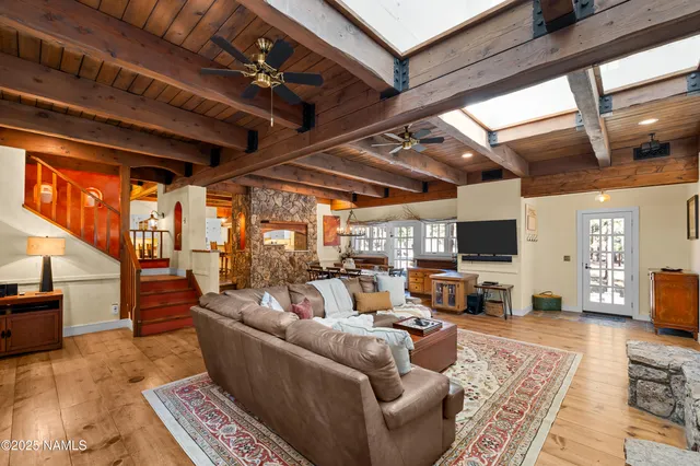 a bedroom with a bed dresser and a window