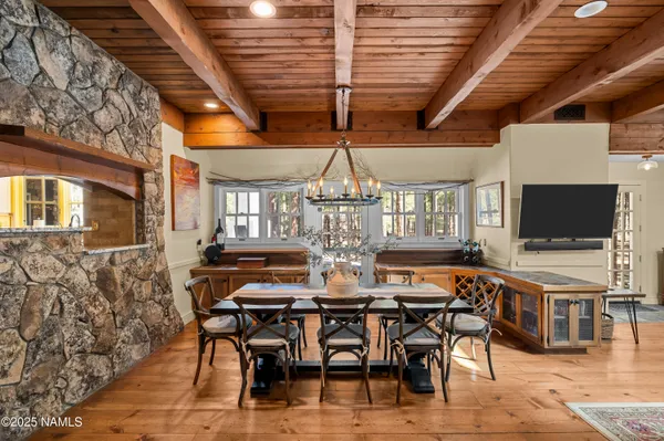 a white table sitting in a living room next to a window