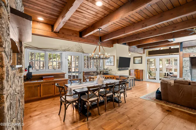 a bedroom with a bed a dresser and book shelf