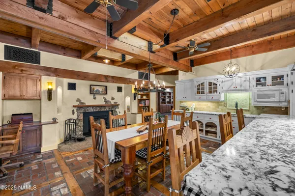 a living room with furniture rug and wooden floor