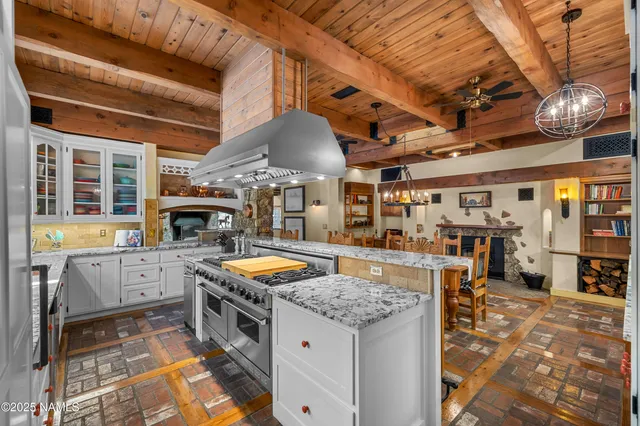 a bedroom with a bed a table and painting on the wall