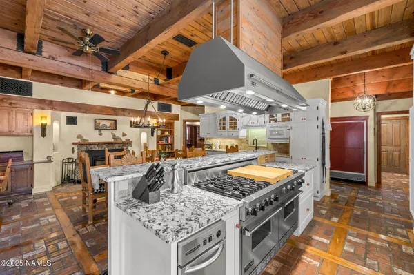 a view of a pathway with a wrought fence