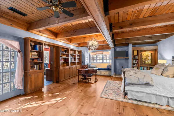 a view of a fire pit with trees in the background