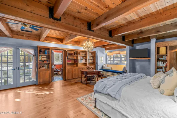 a view of a large house with a tree in the background