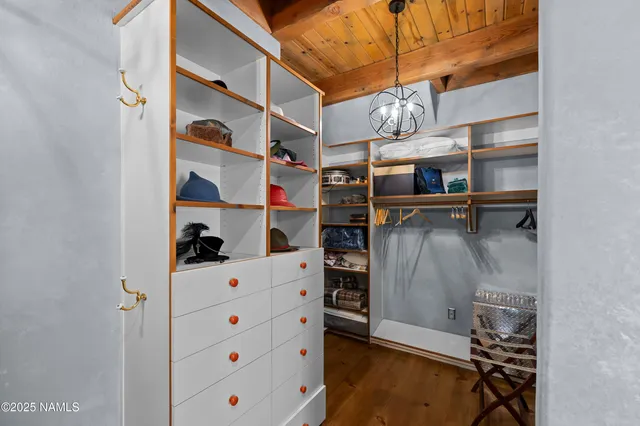 a view of a patio with table and chairs and potted plants