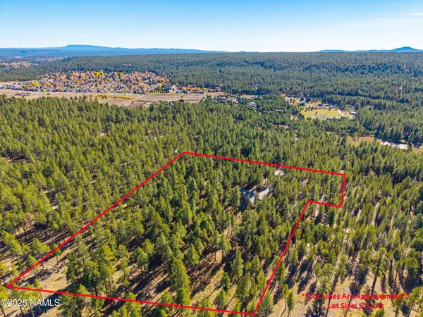 a living room with furniture a flat screen tv and a table