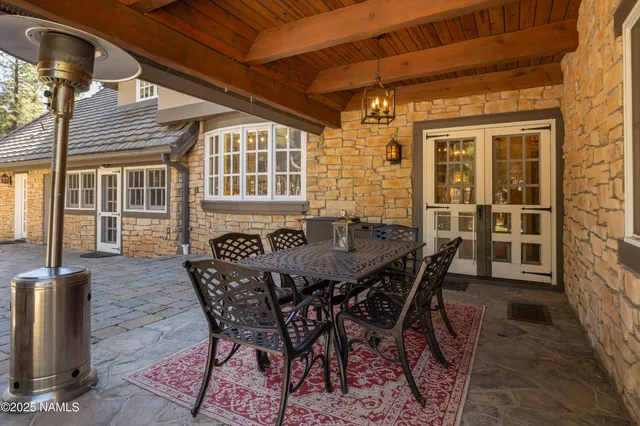 a living room with furniture oven and flat screen tv