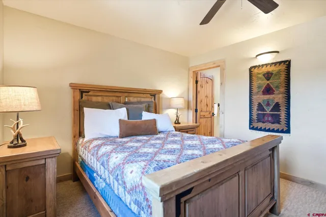 a bedroom with a bed and a table in it