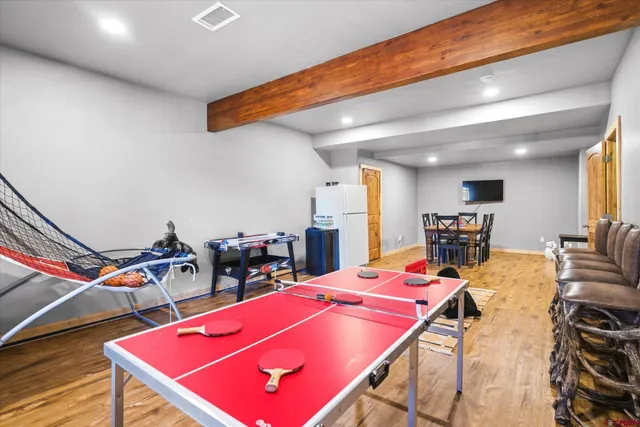 a room with furniture and pool table