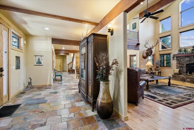 a living room with furniture a rug and a table