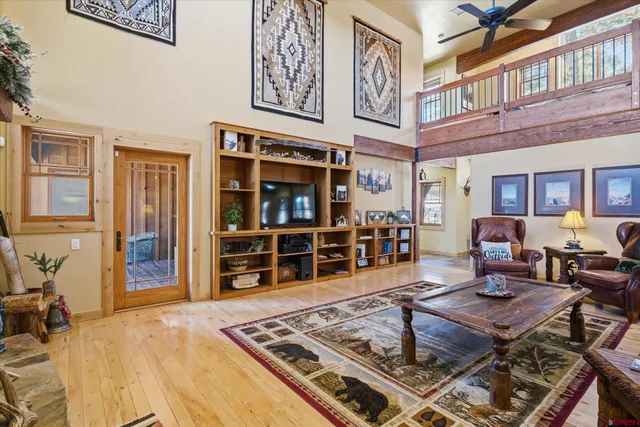 a living room with furniture a rug and a window