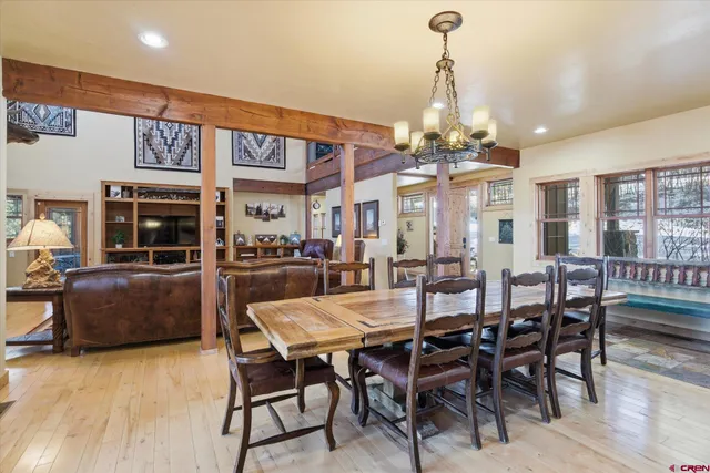 a view of a dining area with furniture window and wooden floor