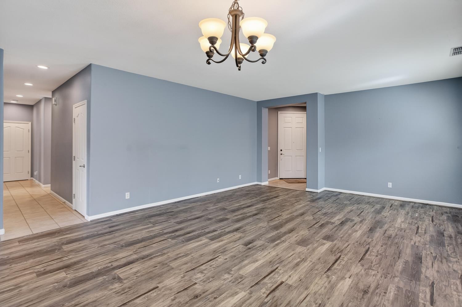 2042 Danforth Way Plumas Lake, CA 95961 - Photo 25 of 56 a view of an empty room with wooden floor and a window