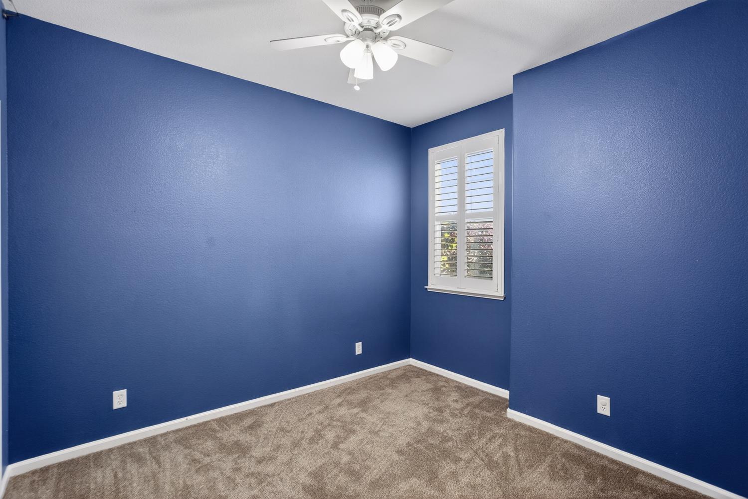 2042 Danforth Way Plumas Lake, CA 95961 - Photo 26 of 56 an empty room with a window and a fan