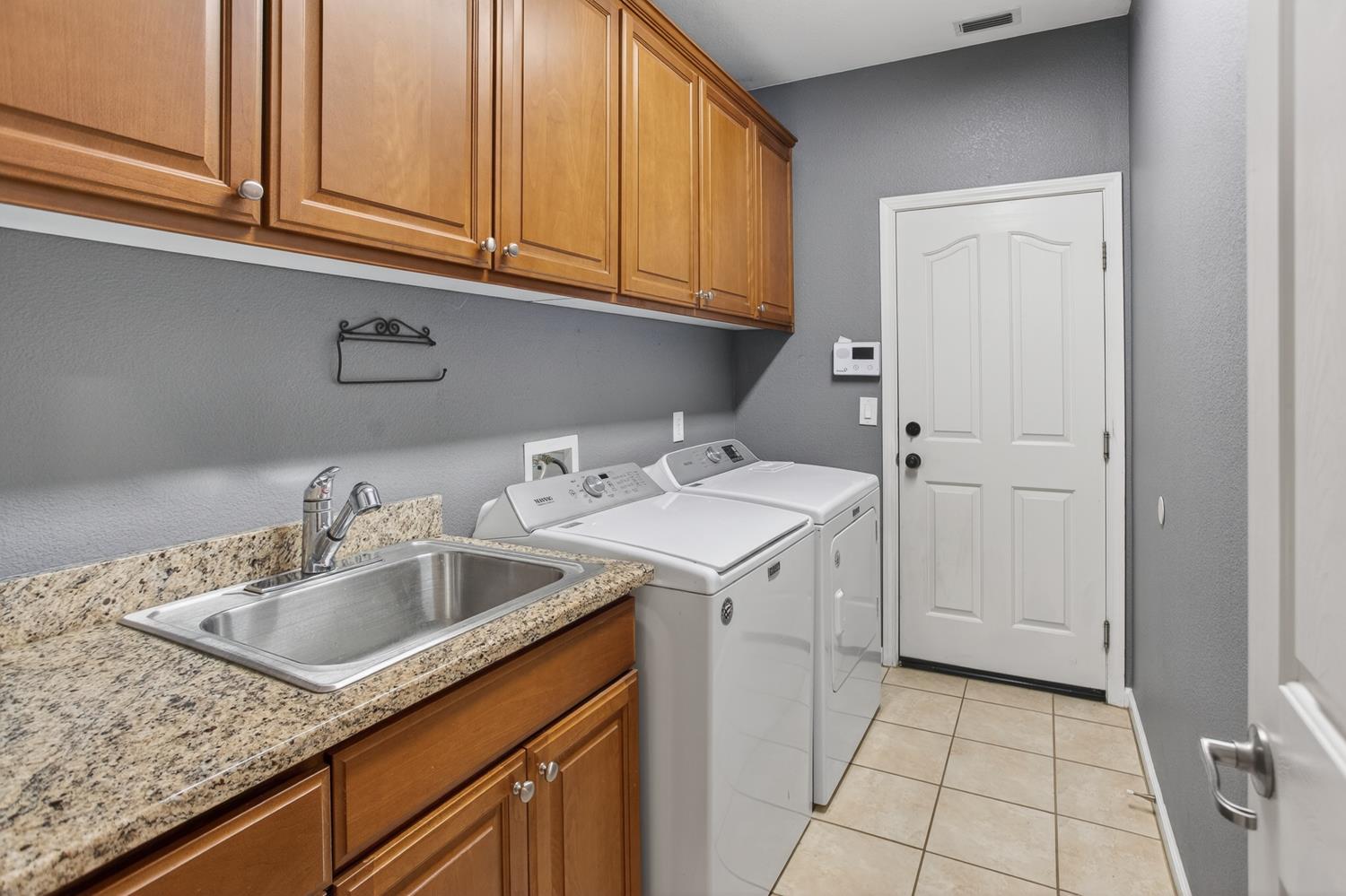 2042 Danforth Way Plumas Lake, CA 95961 - Photo 33 of 56 a kitchen with a sink and cabinets