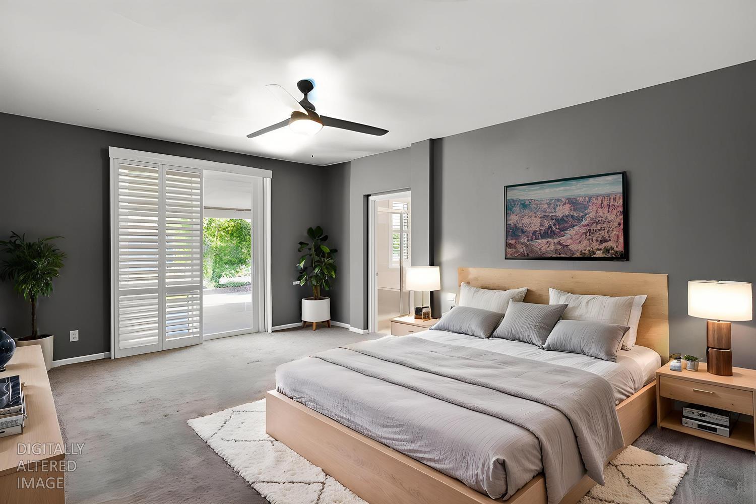2042 Danforth Way Plumas Lake, CA 95961 - Photo 37 of 56 a spacious bedroom with a large bed and a chandelier
