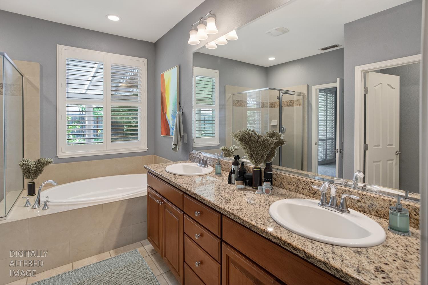2042 Danforth Way Plumas Lake, CA 95961 - Photo 40 of 56 a bathroom with a granite countertop tub double and window