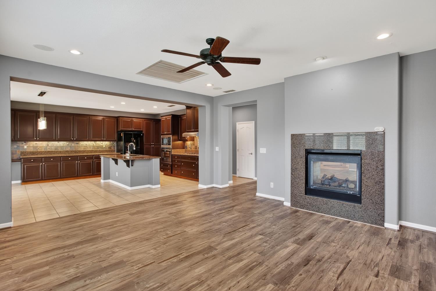 2042 Danforth Way Plumas Lake, CA 95961 - Photo 10 of 56 a view of a kitchen with furniture and a ceiling fan