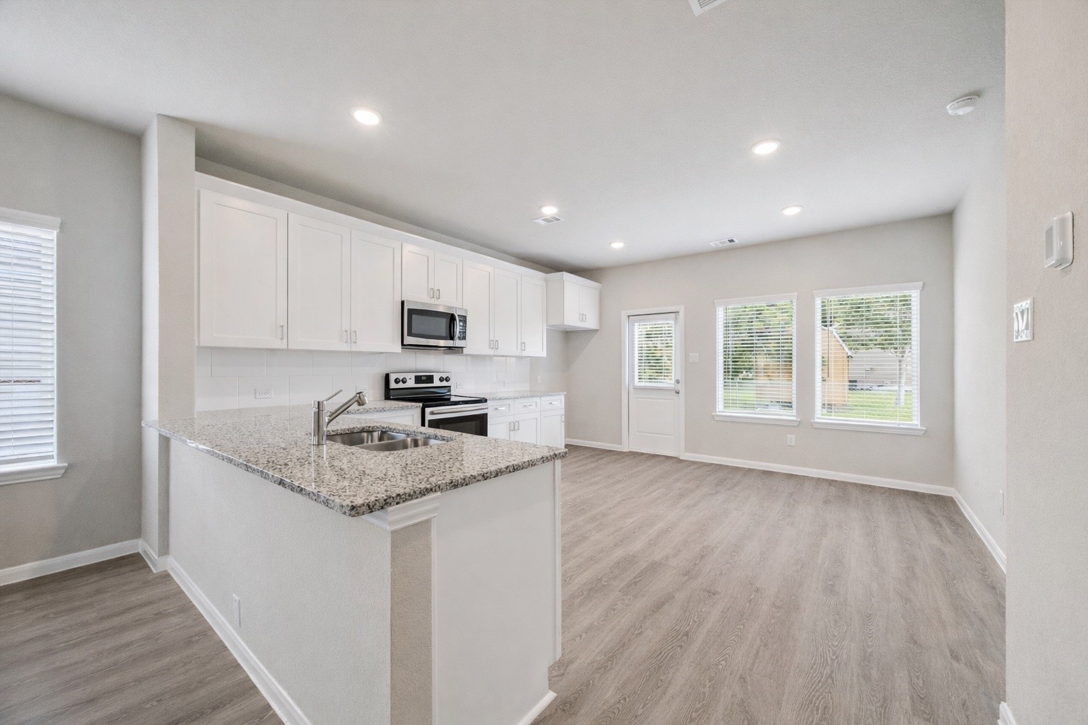 2012 Bellview Street Texas City, TX 77568 - Photo 4 of 23 a kitchen with granite countertop appliances a sink and a counter top space