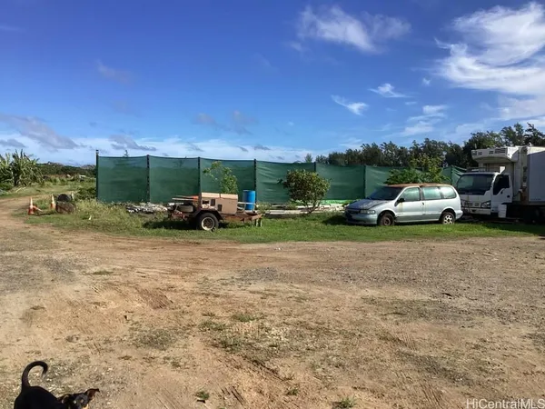 a view of a road with a yard