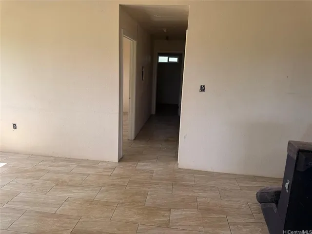 a view of swimming pool with lawn chairs under an umbrella