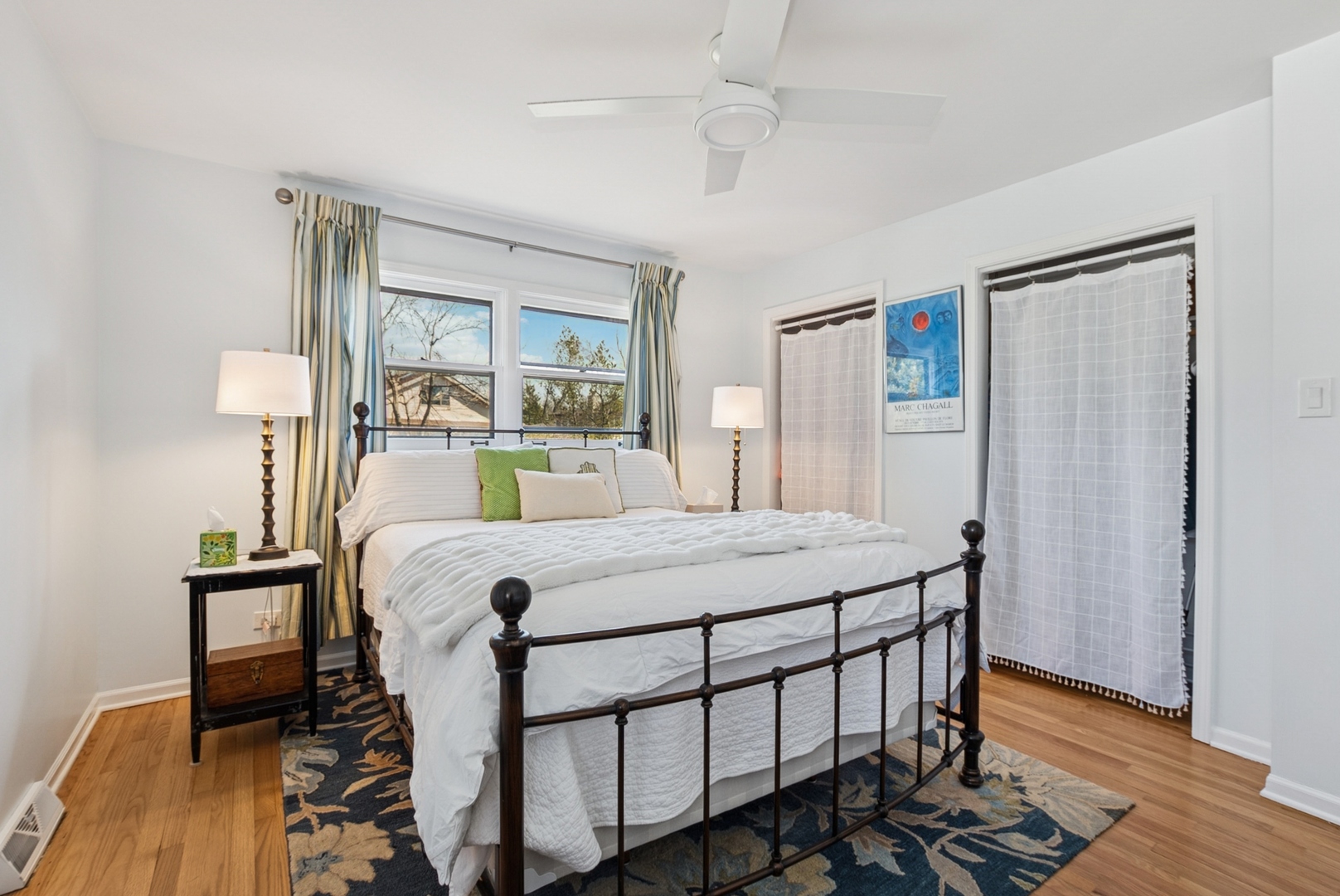 7925 Glen Lane Darien, IL 60561 - Photo 12 of 25 a bed sitting in a bedroom next to a window with wooden floor