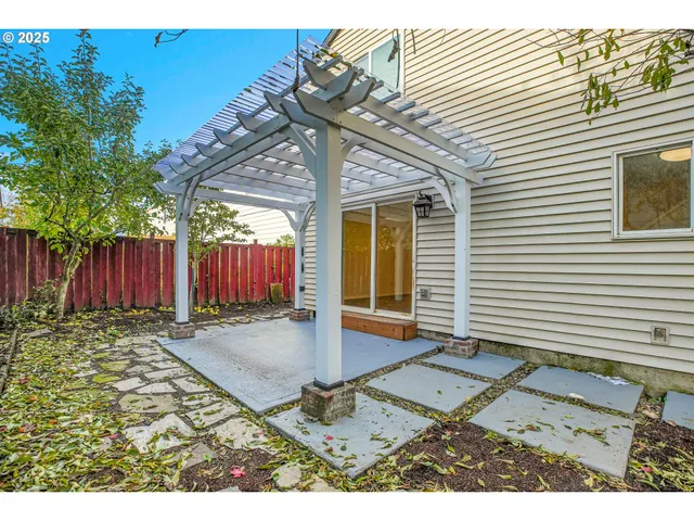 a view of a backyard with furniture