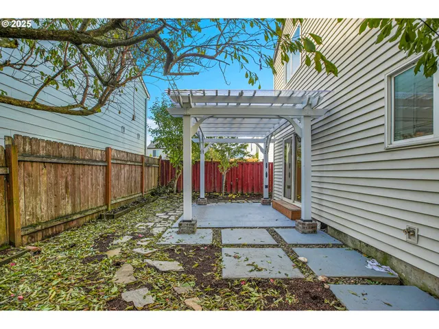 a view of a backyard with a small cabin and a chair