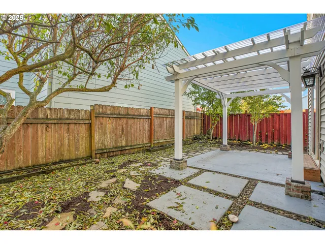 a backyard of a house with shaded area