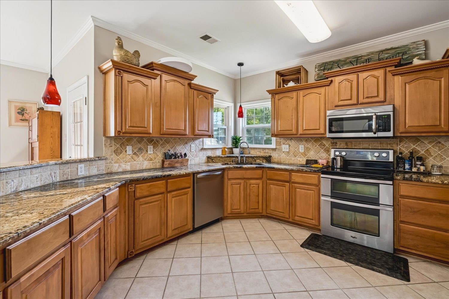 134 Rembert Drive Atoka, TN 38004 - Photo 15 of 28 a kitchen with stainless steel appliances granite countertop a sink and cabinets