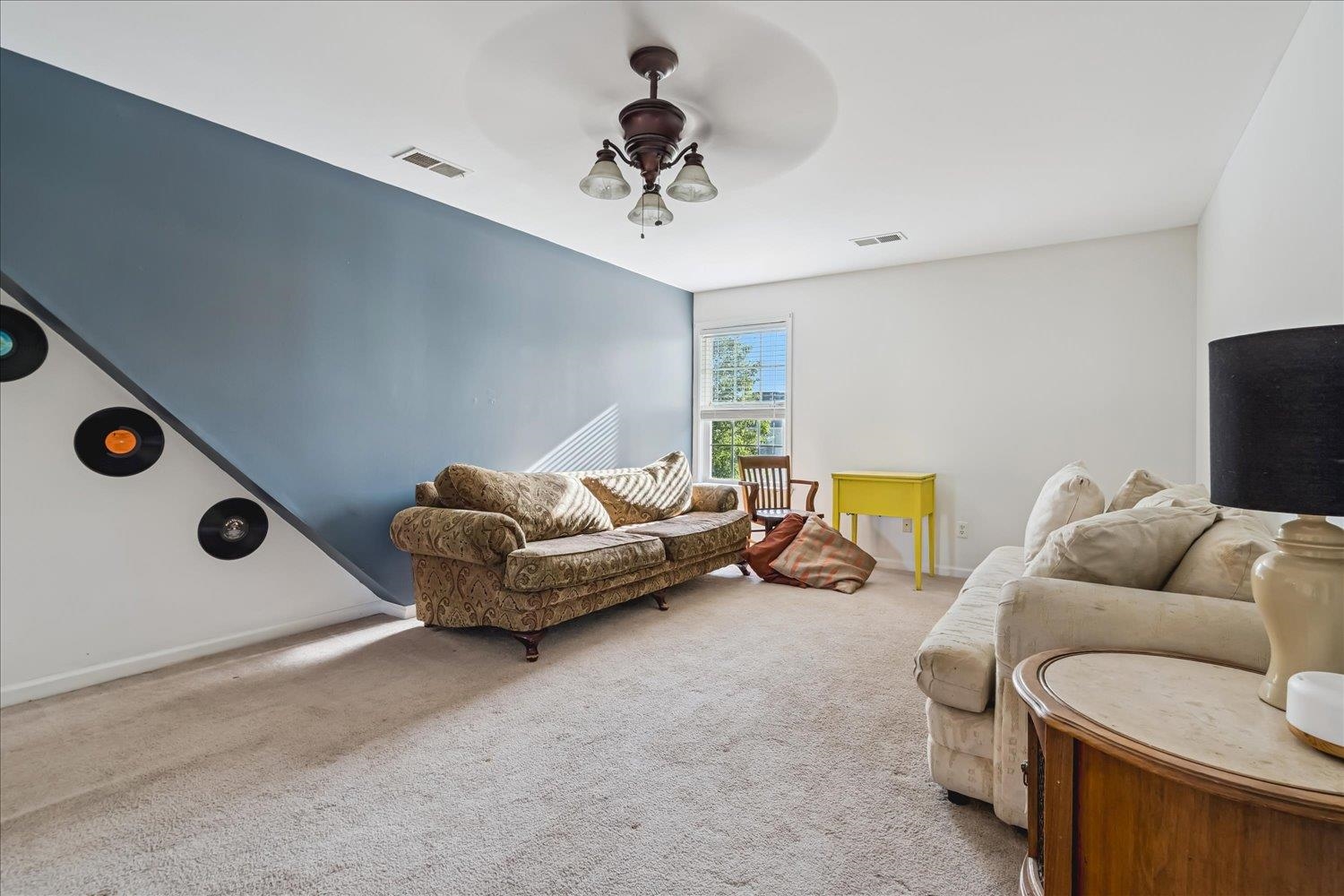 134 Rembert Drive Atoka, TN 38004 - Photo 17 of 28 a living room with furniture and a chandelier