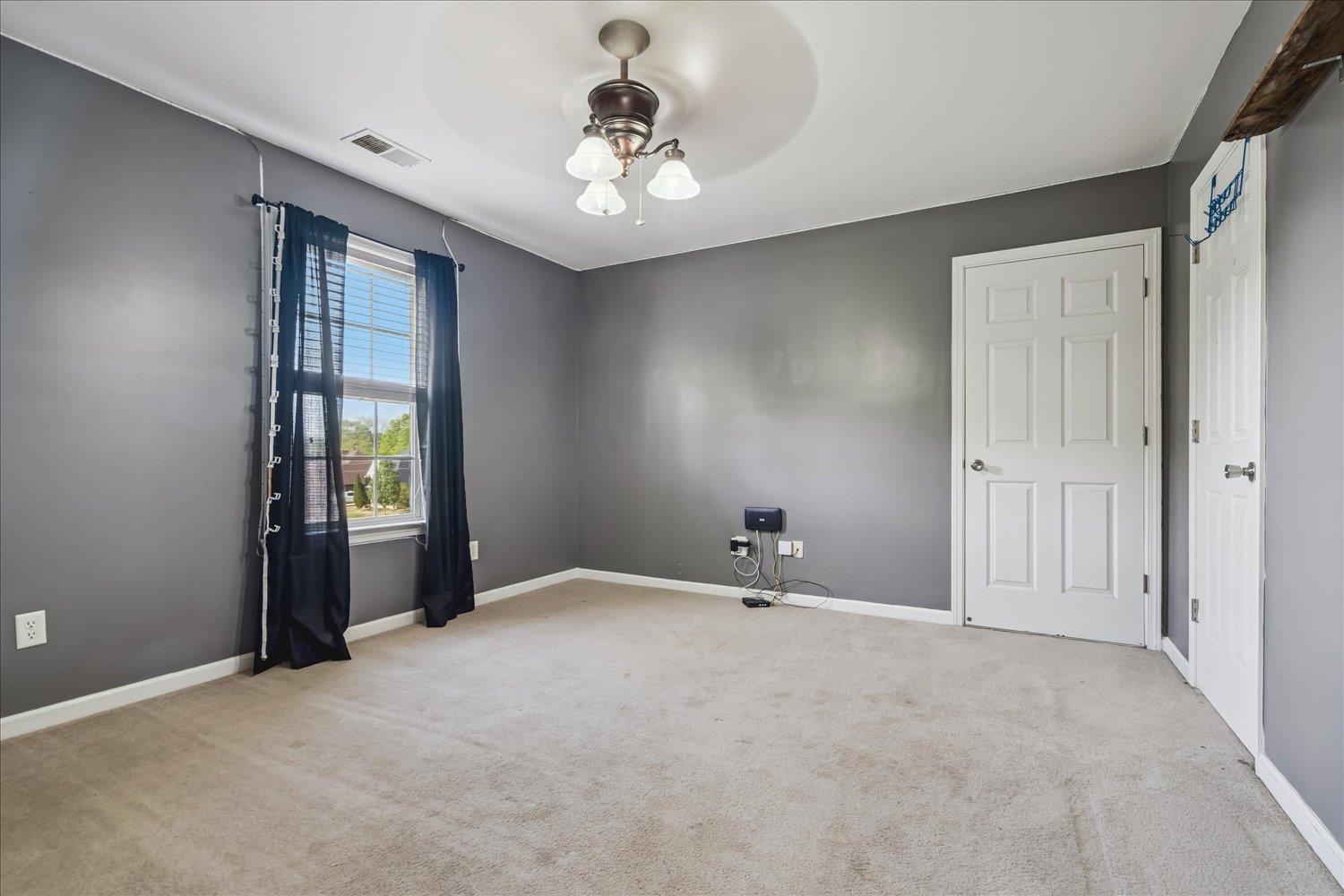 134 Rembert Drive Atoka, TN 38004 - Photo 18 of 28 a view of an empty room with a window